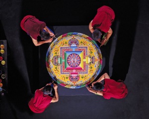 The Drepung Loseling monks create a mandala sand painting.